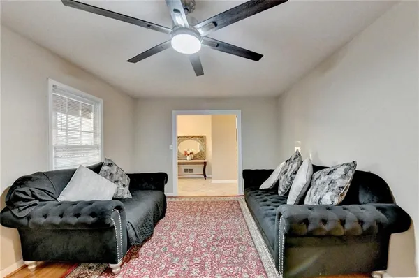 a living room with furniture and a window
