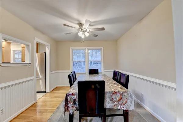 a view of a dining room with furniture and window
