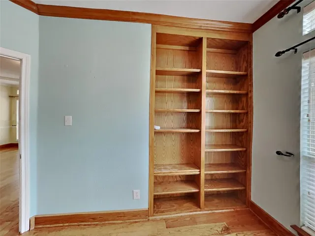 a view of empty room with windows