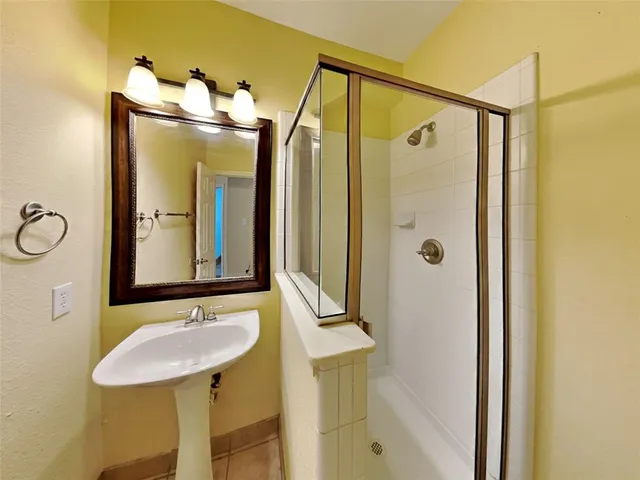 a yellow room with trees in front of it