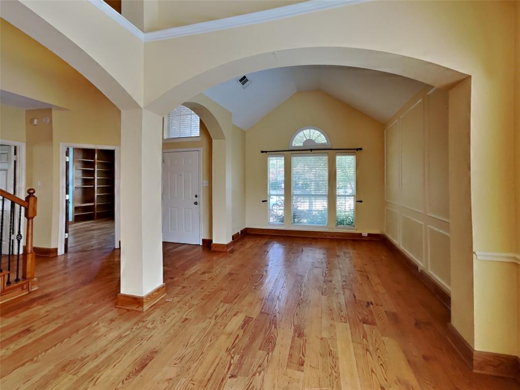 10805 Winged Foot Drive Rowlett, TX 75089 - Photo 2 of 26 wooden floor in an empty room with a window