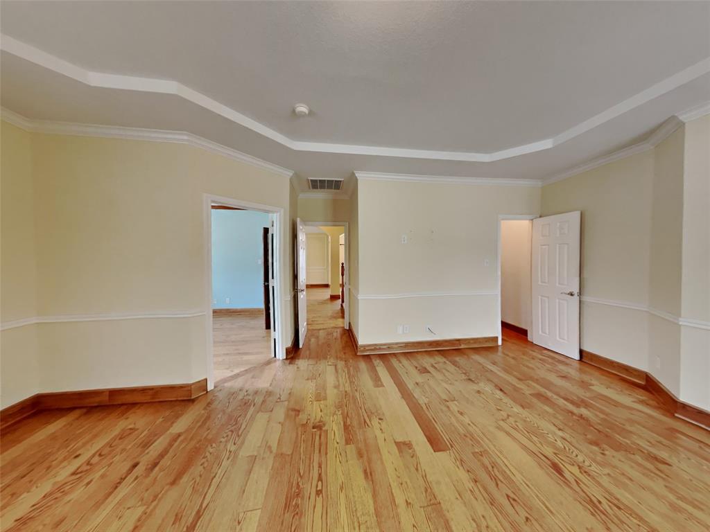 10805 Winged Foot Drive Rowlett, TX 75089 - Photo 10 of 26 a view of empty room with wooden floor