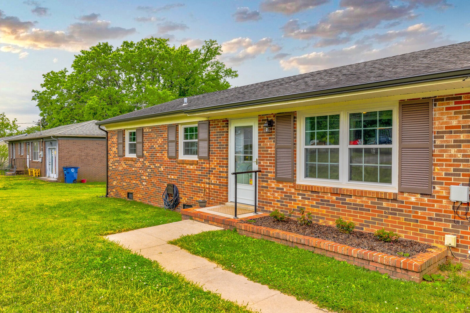 front view of a house with a yard