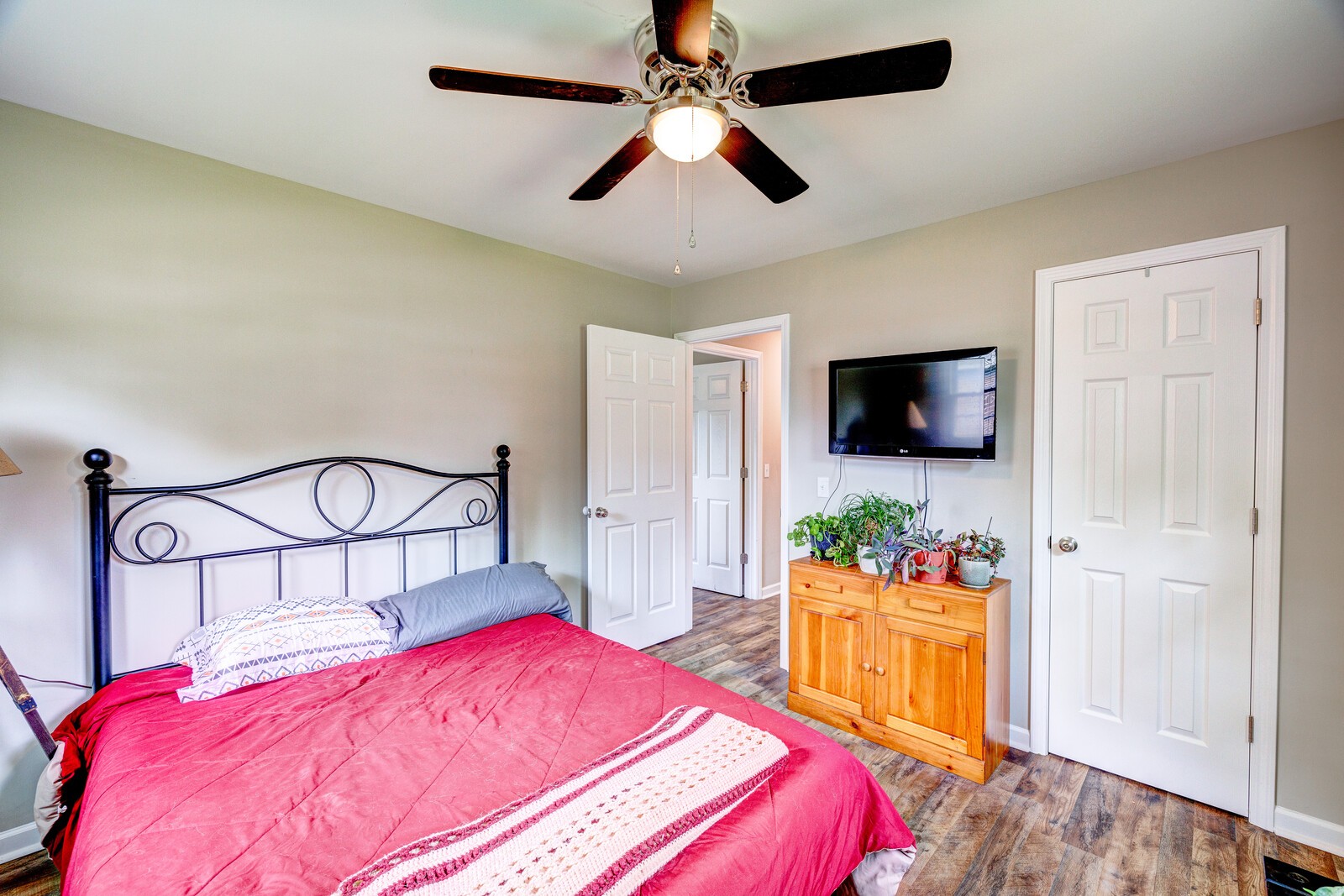 1721 Midland Road Shelbyville, TN 37160 - Photo 18 of 29 a bedroom with a bed and a flat tv screen on dresser