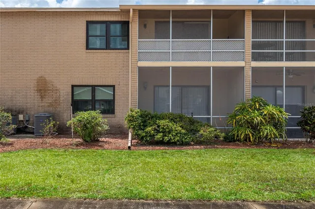 a view of house with backyard and garden
