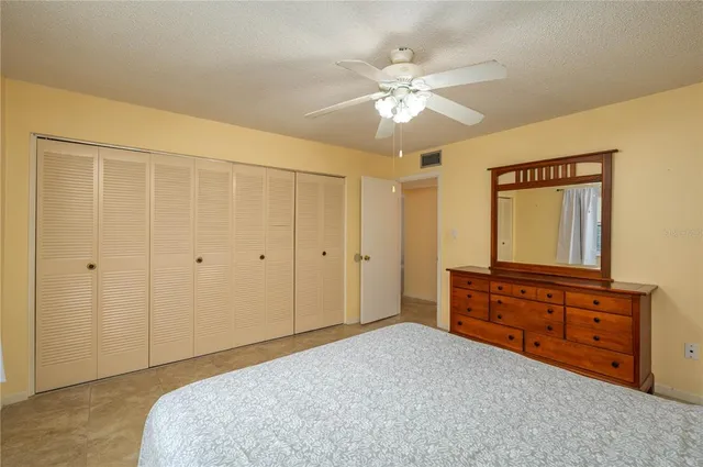 a bedroom with a bed and a dresser