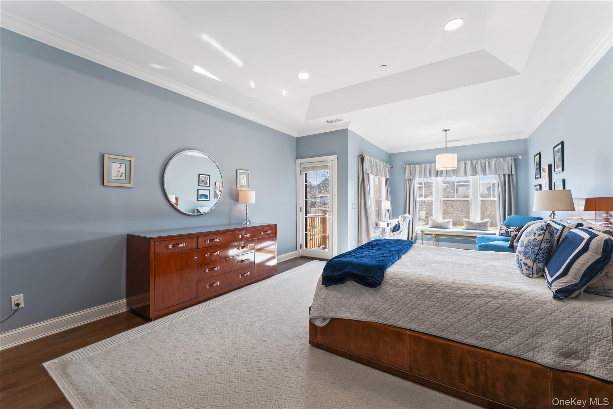 6 Hudson View Way Tarrytown, NY 10591 - Photo 22 of 50 a spacious bedroom with a large bed and wooden floor