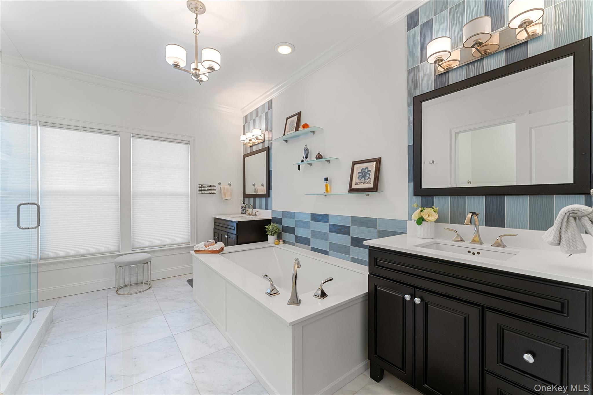 6 Hudson View Way Tarrytown, NY 10591 - Photo 27 of 50 a bathroom with a sink a large mirror and a bathtub