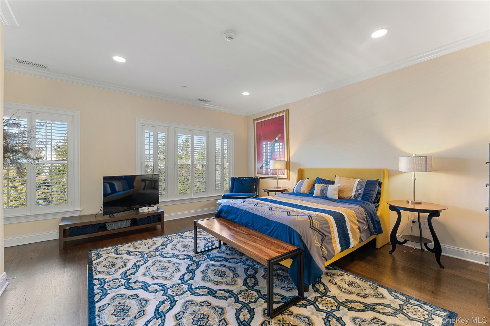 6 Hudson View Way Tarrytown, NY 10591 - Photo 30 of 50 a bedroom with a bed a couch and wooden floor