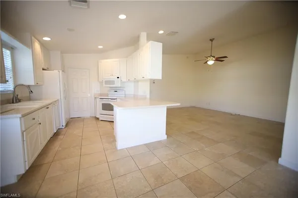 a view of a kitchen with a sink