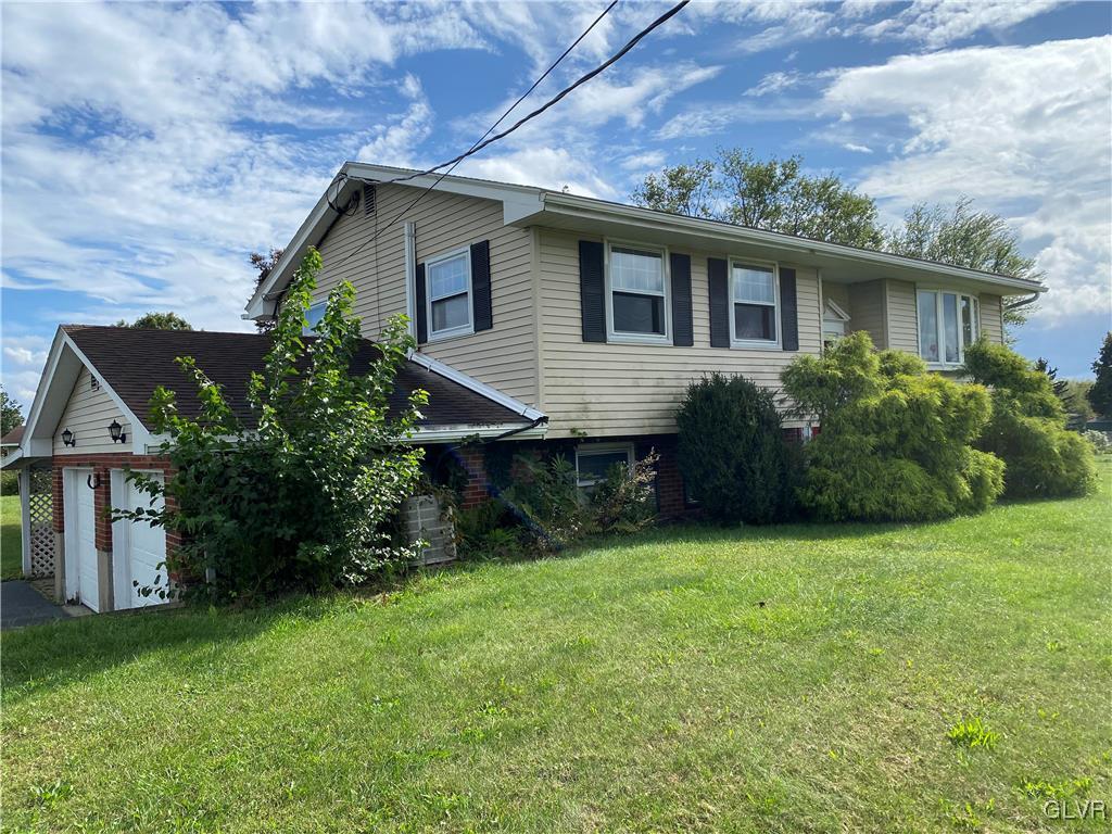 558 Lefevre Road Easton, PA 18040 - Photo 1 of 1 a front view of house with yard and green space