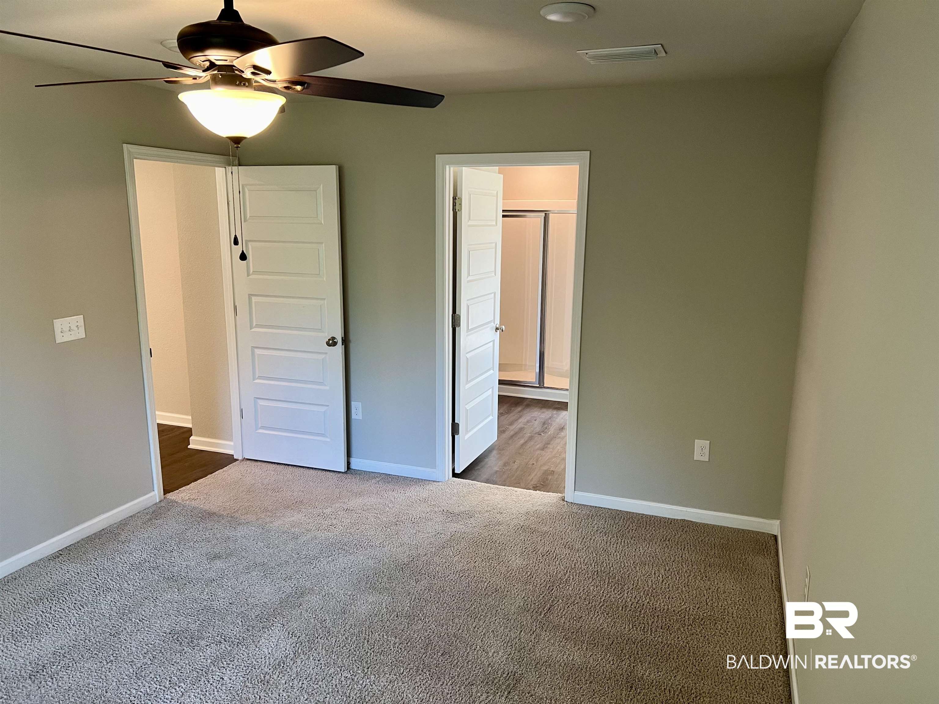 1612 Abbey Loop Foley, AL 36535 - Photo 17 of 30 Unfurnished bedroom featuring carpet, ensuite bath, and ceiling fan