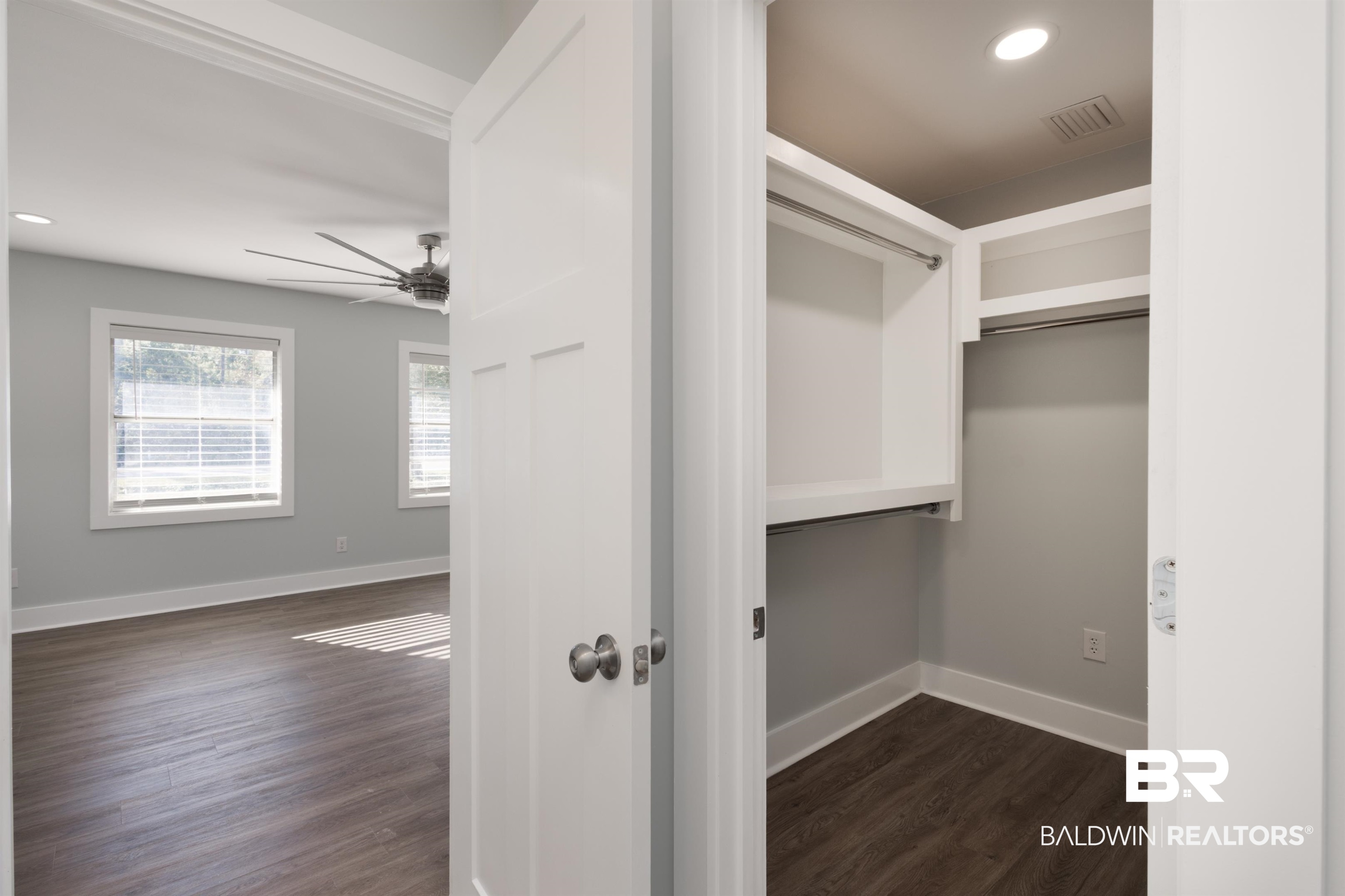 18267 Highway 98 Foley, AL 36535 - Photo 11 of 26 Spacious closet featuring dark wood-style floors and ceiling fan