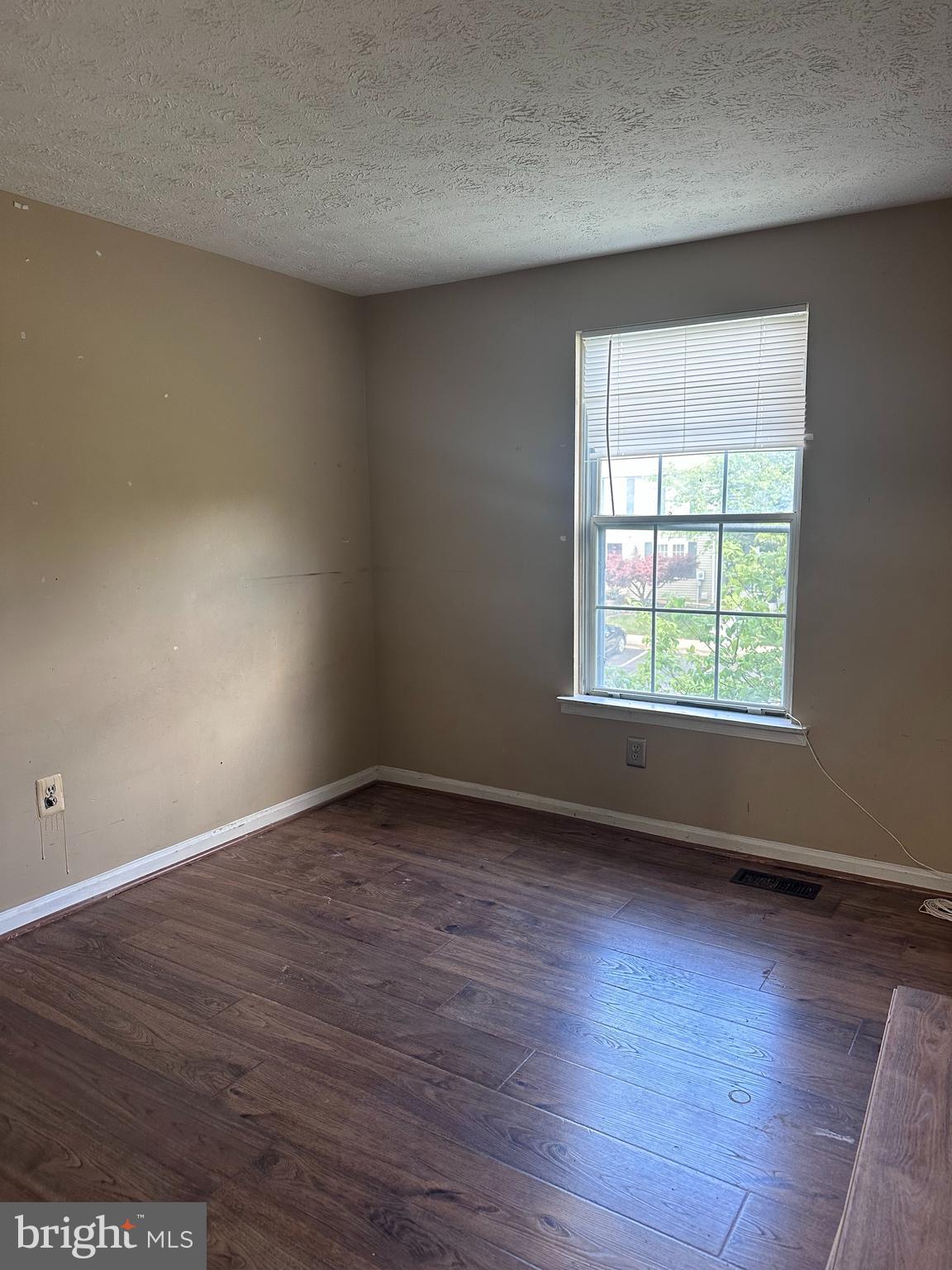 1488 Dockside Court Frederick, MD 21701 - Photo 13 of 16 an empty room with wooden floor and windows