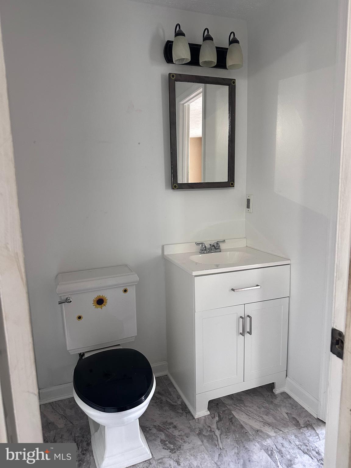 1488 Dockside Court Frederick, MD 21701 - Photo 10 of 16 a bathroom with a sink toilet and mirror