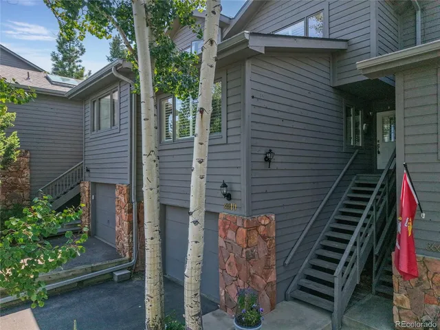 a view of a patio with wooden wall
