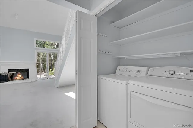 a view of storage and utility room with washer and dryer