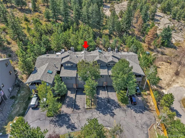 an aerial view of a house with an outdoor space