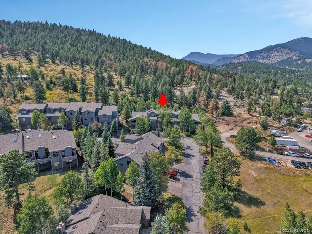 a view of a town with mountains in the background