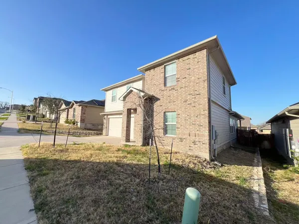 a kitchen with stainless steel appliances kitchen island granite countertop a sink refrigerator and microwave