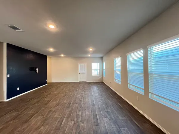 a large kitchen with kitchen island granite countertop a large counter top stainless steel appliances and cabinets