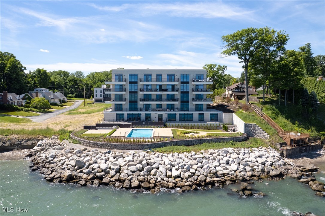 22700 Lake Road, Unit 306 Rocky River, OH 44116 - Photo 28 of 28 Aerial view of property and surrounding area with a large body of water and a pool