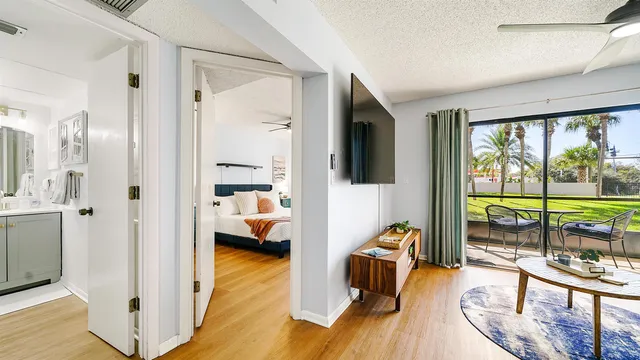 a view of a living room and a balcony