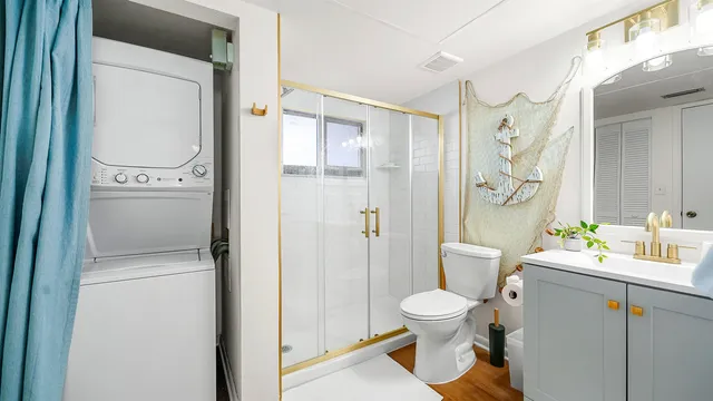 a bathroom with a toilet a sink and a shower
