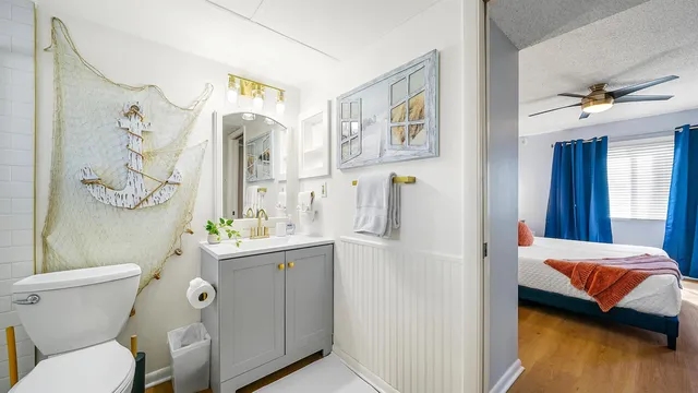 a bathroom with a sink toilet and shower
