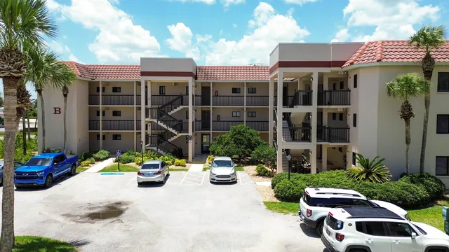 a view of a chair and table in front of house