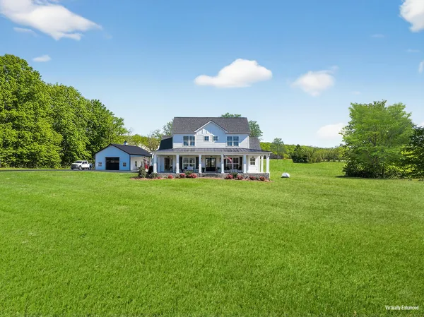 a view of a house with a big yard