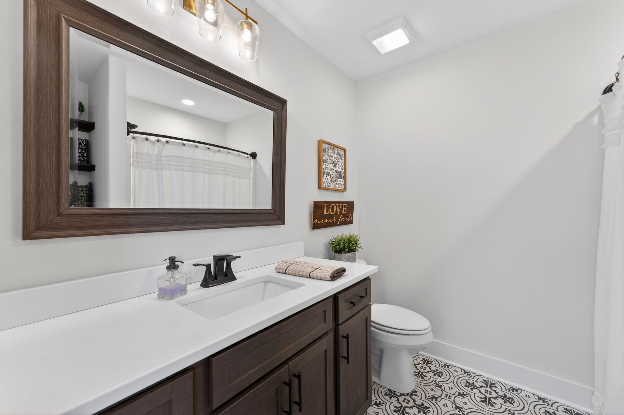 10640 Jordan Road Lascassas, TN 37085 - Photo 19 of 45 a bathroom with a granite countertop toilet sink and mirror