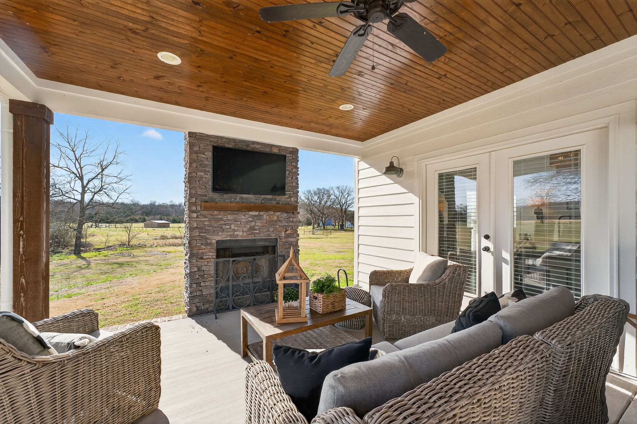10640 Jordan Road Lascassas, TN 37085 - Photo 21 of 45 a living room with furniture a fireplace and a flat screen tv