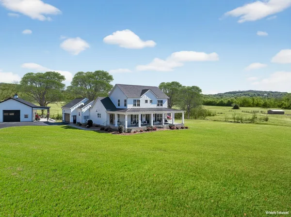 a view of a house with a big yard