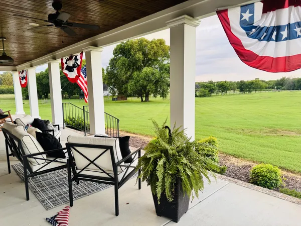 a view of an outdoor sitting area with furniture