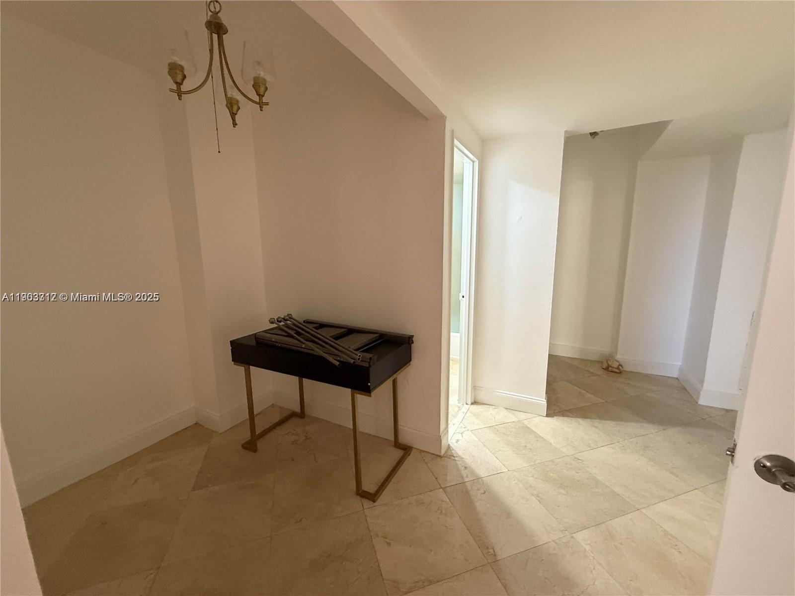 10185 Collins Avenue, Unit 308 Bal Harbour, FL 33154 - Photo 19 of 25 a view of room with a bench