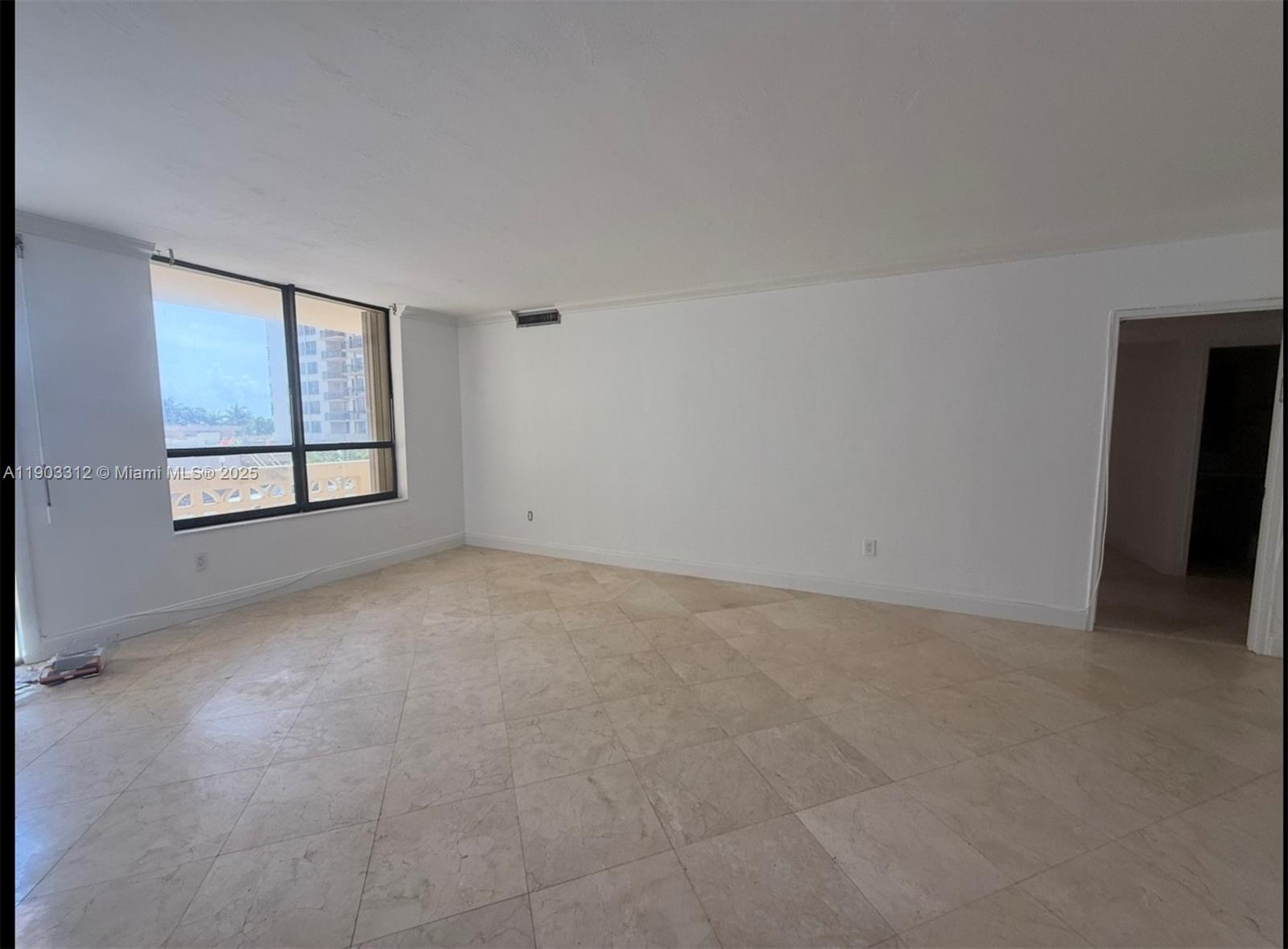 10185 Collins Avenue, Unit 308 Bal Harbour, FL 33154 - Photo 3 of 25 an empty room with windows and closet