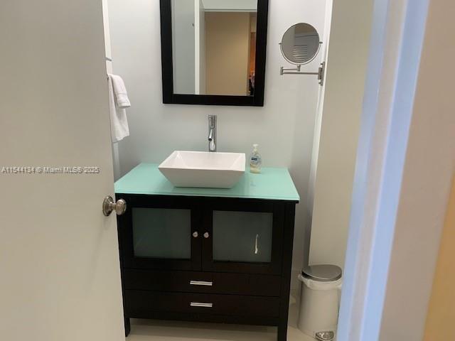 100 Lincoln Road, Unit 819 Miami Beach, FL 33139 - Photo 11 of 33 a bathroom with a sink and a mirror