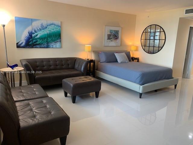 100 Lincoln Road, Unit 819 Miami Beach, FL 33139 - Photo 3 of 33 a bedroom with furniture and a window