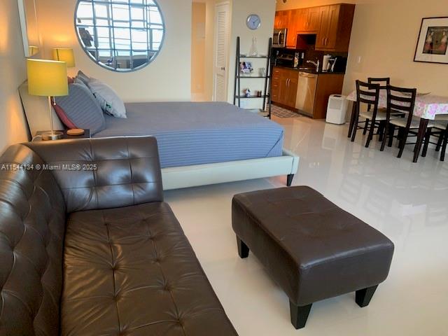 100 Lincoln Road, Unit 819 Miami Beach, FL 33139 - Photo 4 of 33 a living room with furniture and a wooden floor