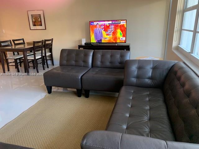 100 Lincoln Road, Unit 819 Miami Beach, FL 33139 - Photo 5 of 33 a living room with furniture and a flat screen tv