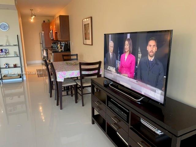 100 Lincoln Road, Unit 819 Miami Beach, FL 33139 - Photo 6 of 33 a view of a chairs and fire pit in a kitchen