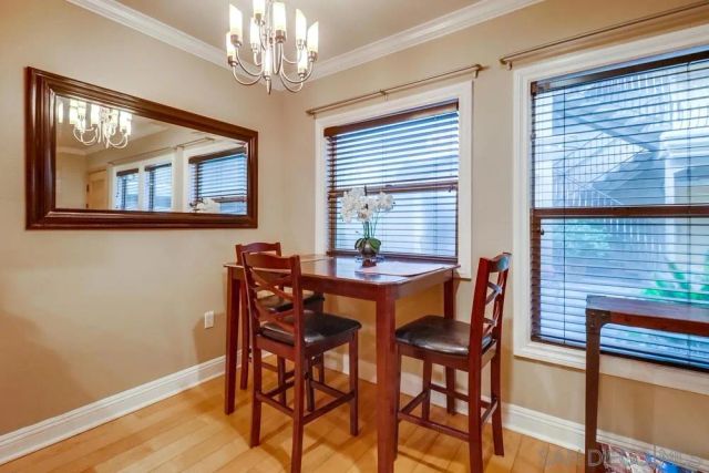 a dining room with furniture and window