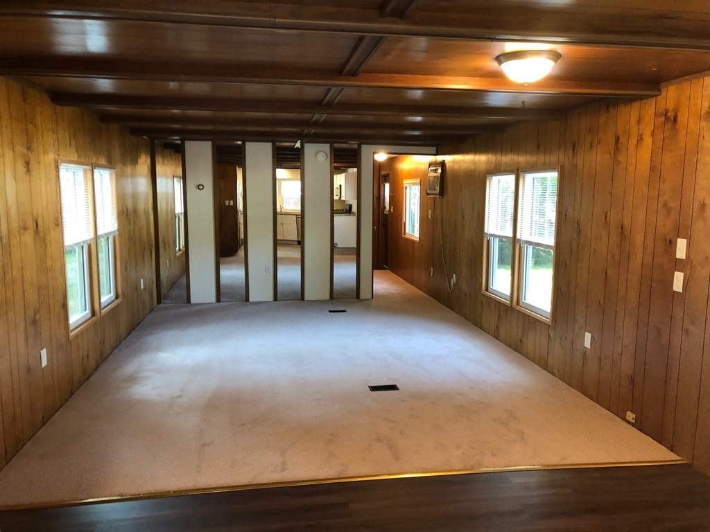 8 Lisa Circle Merrimac, MA 01860 - Photo 11 of 17 a view of an empty room with wooden floor and a window
