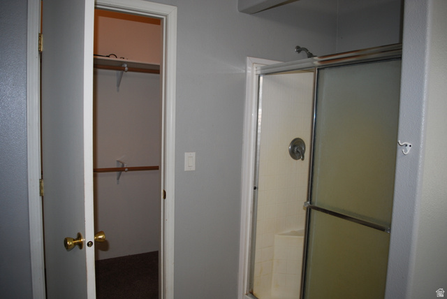 1055 West Ashby Road Delta, UT 84624 - Photo 34 of 44 Shower enclosure with sliding glass doors and polished chrome fixtures