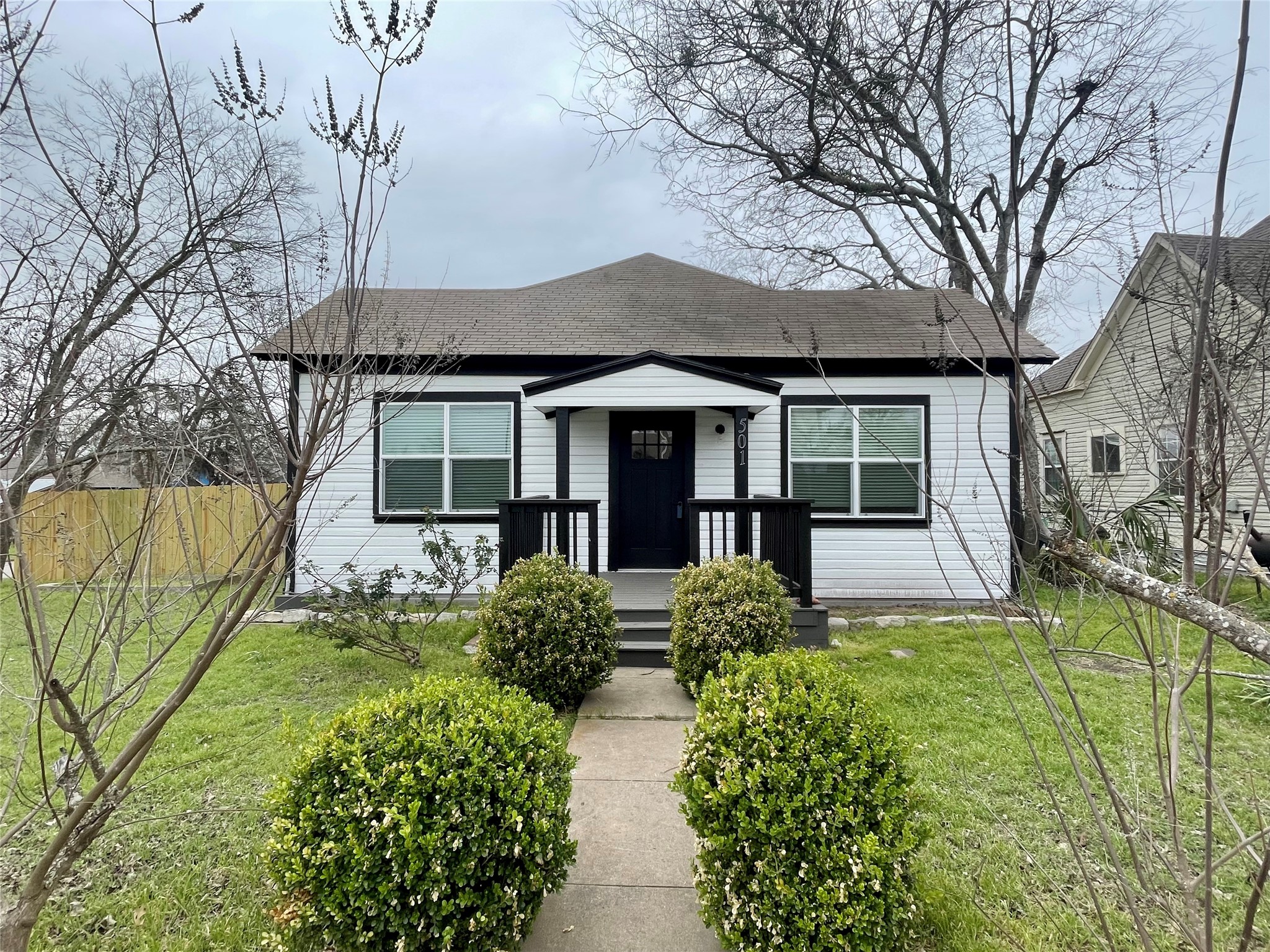 501 North Doak Street Taylor, TX 76574 - Photo 1 of 10 a front view of a house with garden