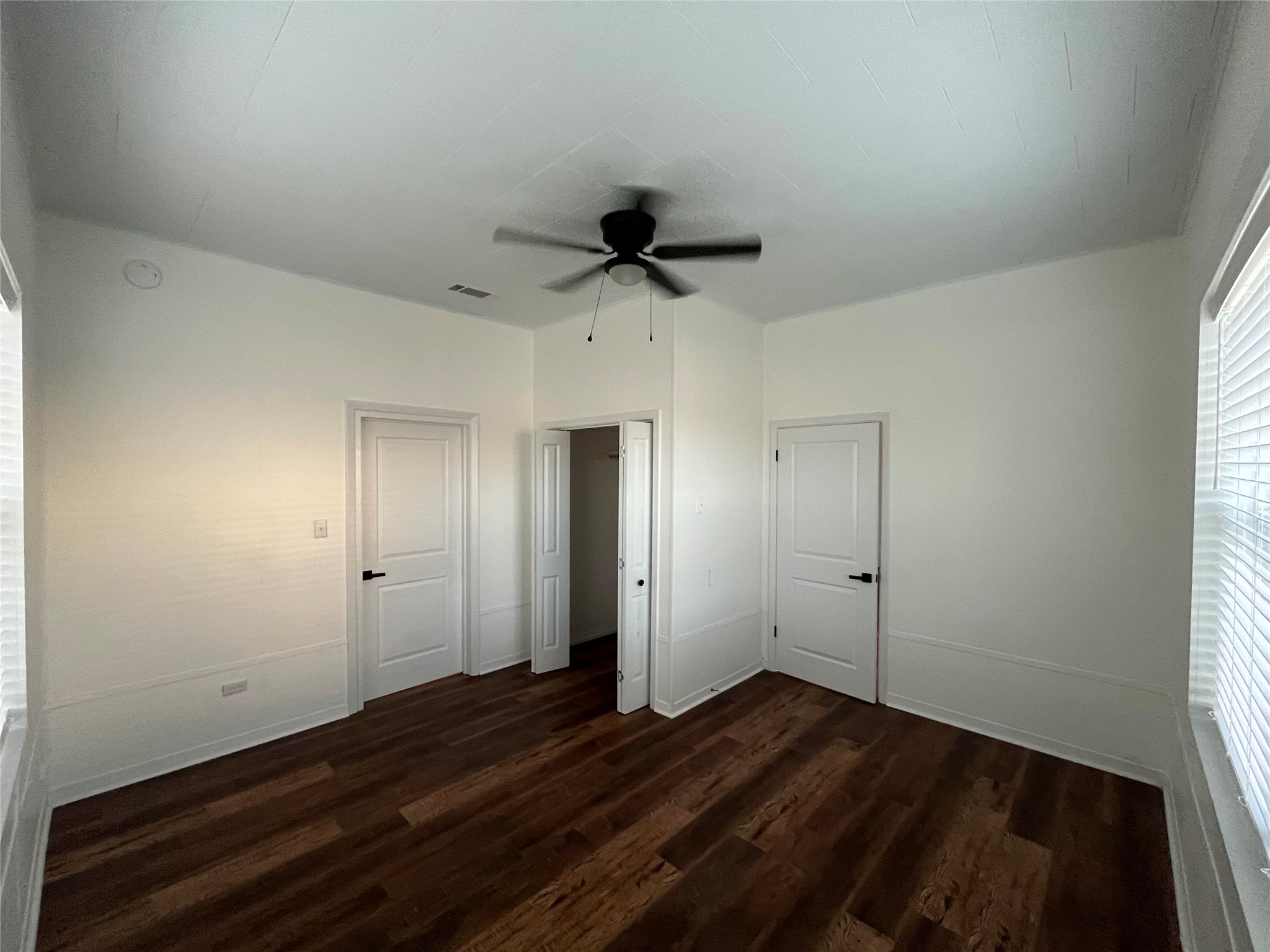 501 North Doak Street Taylor, TX 76574 - Photo 3 of 10 a view of empty room with wooden floor and window