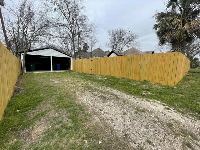 a big yard with large trees