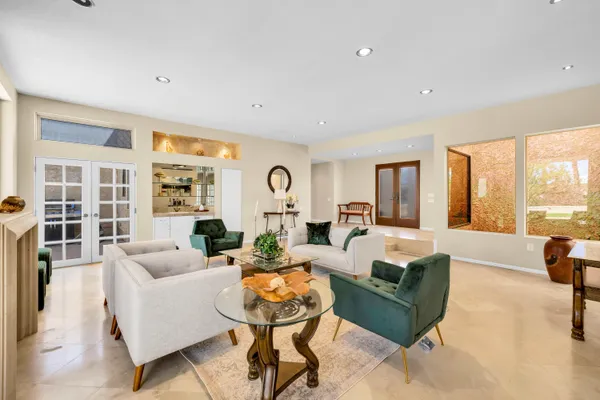 a living room with furniture and a large window