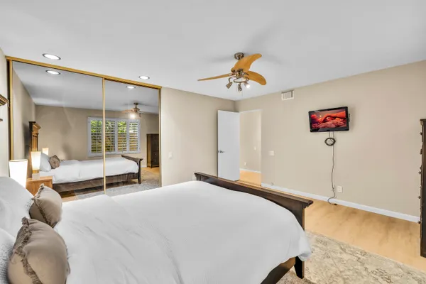 a bedroom with furniture and a window